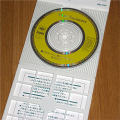 「21世紀の恋人」8cmシングルCDの盤面とパッケージ